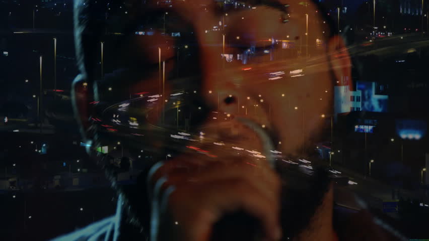 Music featuring singer holding microphone building intensity, overlaying city traffic timelapse. Vocals, performance, urban, nightlife, atmosphere, energy, emotion