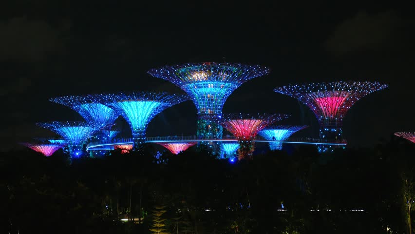 Illuminated supertree grove Singapore, highlighting futuristic architectural landscape at Singapore gardens by the bay