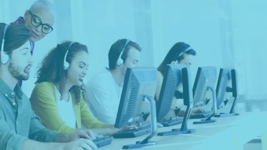 Manager entering call center leaning over shoulder guiding agents with data overlay shifting color. Customer service, teamwork, digital analytics, professional environment, corporate communication, - Powered by Shutterstock - Get 15% off with code: PIKWIZARD15