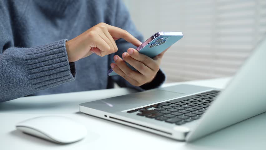 Female businessman working with smart phone.