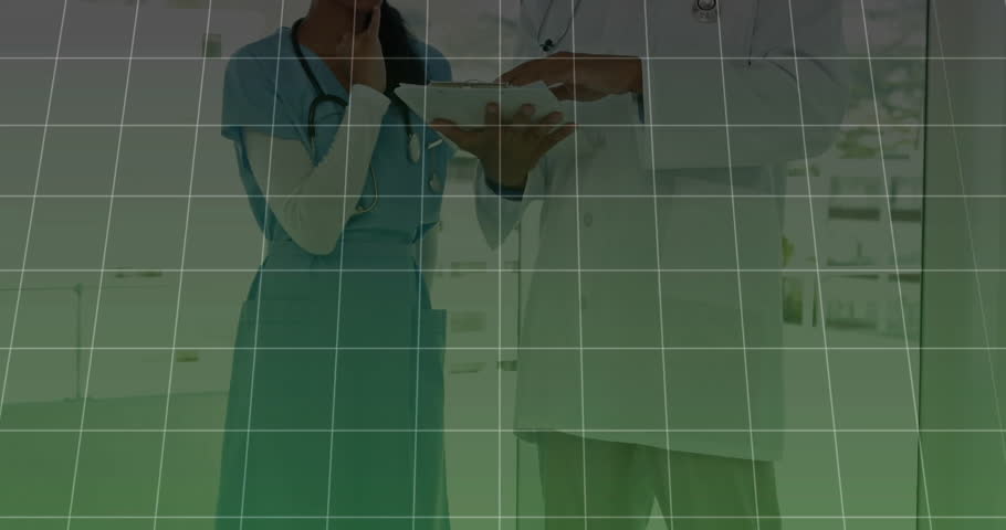 Medical doctors tapping tablet, activating green chart and graph fluctuating upward reviewing data. Healthcare, data, analytics, innovation, teamwork, digital, professional