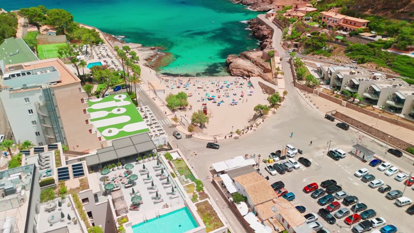 Aerial view of Cala Sant Vicent resort in Mallorca, Balearic Islands, Spain. Stunning sandy beach with turquoise waters, a popular holiday destination on Majorca island.