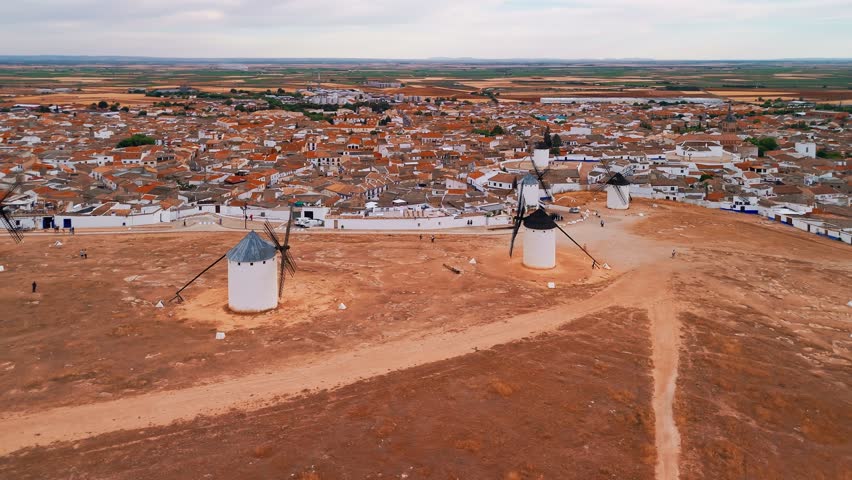 Aerial view of the historic windmills of Campo de Criptana, Castilla-La Mancha, Spain. Old historic windmills of Don Quixote character on the hills. Molinos de Viento de Campo de Criptana