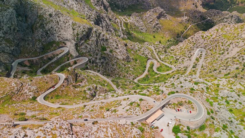 Aerial view of the stunning landscape with the famous Sa Calobra Road in Mallorca, Balearic Islands, Spain. A winding scenic road cutting through the majestic Tramuntana Mountains on Majorca island.