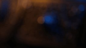 Close-up pan from a patterned fabric belt to its ornate, traditional filigree metal buckle. Dramatic blue and warm lighting highlights the intricate details and craftsmanship. - Powered by Shutterstock - Get 15% off with code: PIKWIZARD15