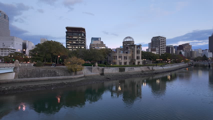 Panning shot of Hiroshima, Japan, showing the iconic Hiroshima Peace Memorial, aka Atomic Bomb Dome, the only structure left standing in the area where the first A-bomb exploded August 6, 1945.