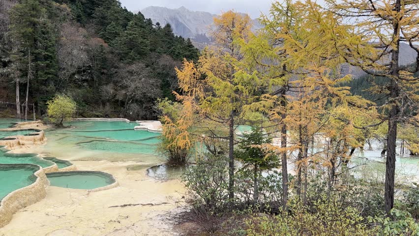 Wide pan shot of the Huanglong Lake in China