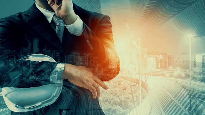 Future building construction and inventive engineering project concept with HUD hologram graphic design. Building engineer, architect people or construction worker works with modern civil technology.