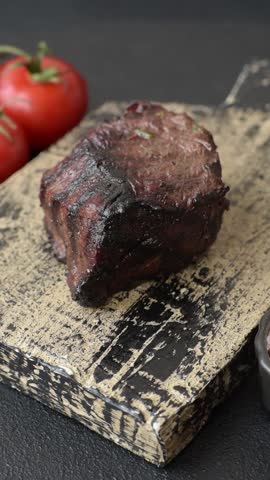 Grilled beef steak meat with salt and pepper. Beef steak grilled on a barbecue as a background for your design