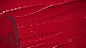 Red lipstick texture smeared in smooth, creamy strokes. Bold cosmetic background perfect for beauty, fashion, and makeup related themes. Red lipstick background. - Powered by Shutterstock - Get 15% off with code: PIKWIZARD15