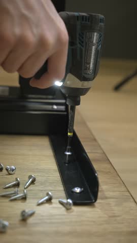 The screwdriver tightens the screws