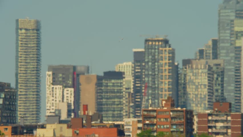 View at city in Eastern Canada during climate change, record-breaking heat wave in one of world's hottest cities. Increased respiratory and cardiovascular distress due extreme heat dome.