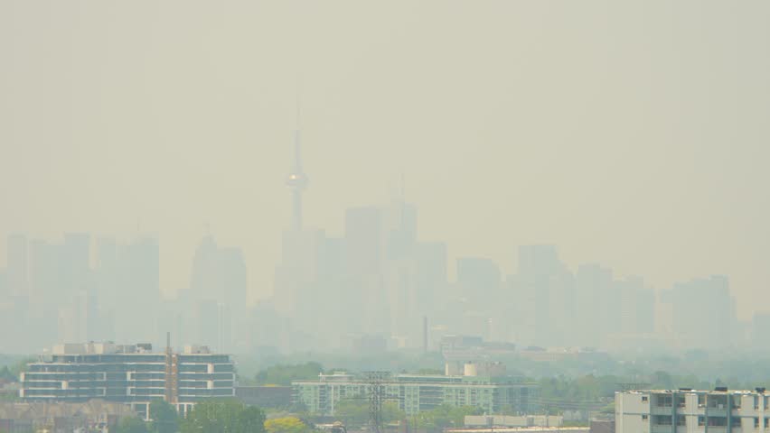 View at city in Eastern Canada during climate change, record-breaking heat wave in one of world's hottest cities. Increased respiratory and cardiovascular distress due extreme heat dome. Wild fires.