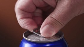 Human hand open aluminum beverage can. Drink in metal jar closeup. Opening soda can - Powered by Shutterstock - Get 15% off with code: PIKWIZARD15