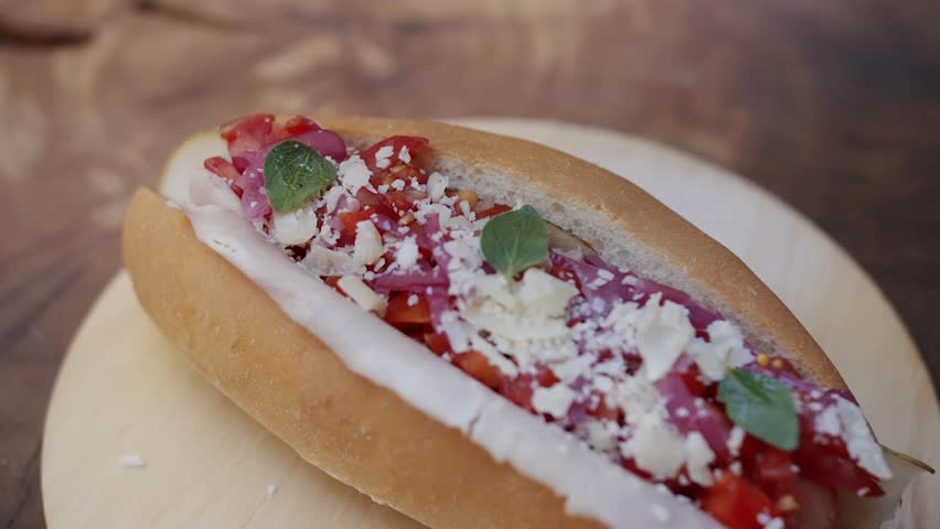 Steaming homemade grilled hot dogs on buns with generous toppings. Appetizing big city street food, ideal for urban dining concepts.