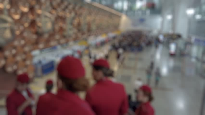 Bokeh view of arrival zone of Indira Gandhi International Airport in New Delhi, India. Blurred background footage.