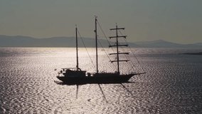 Three-Masted Sailing Ship Gliding on the Aegean Sea at Sunset - Powered by Shutterstock - Get 15% off with code: PIKWIZARD15