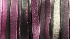 Purple and silver ribbons waving gracefully, intertwining with elegant metallic sheen and creating dynamic abstract visual composition against pristine white backdrop. 3D Illustration - Powered by Shutterstock - Get 15% off with code: PIKWIZARD15