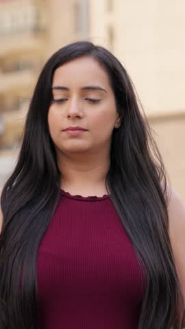 Vertical Video of Indian Woman Relaxing and taking Deep Breath