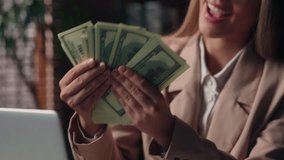 Close up happy glad rich wealthy Caucasian business woman female businesswoman boss laptop employer entrepreneur girl holding hands fan stack money cash salary wage income profit dollars indoor office - Powered by Shutterstock - Get 15% off with code: PIKWIZARD15