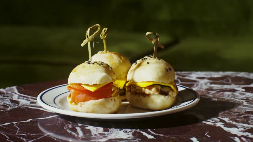 Trio of Small Gourmet Burgers – Close-Up of Mini Sliders with Fresh Ingredients in 4K Ultra HD