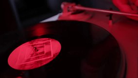 Enjoying captivating, nostalgic moments as a vinyl record spins on a turntable surrounded by vibrant lighting - Powered by Shutterstock - Get 15% off with code: PIKWIZARD15
