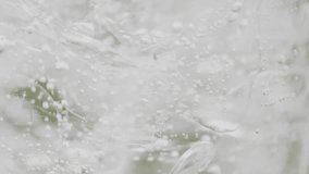 Super slow motion footage: Carbonated water being poured into a glass filled with ice in the summer outdoors - Powered by Shutterstock - Get 15% off with code: PIKWIZARD15