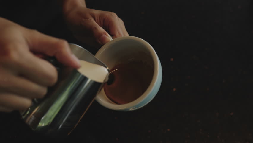 Slow motion Coffee Barista making Latte art, Art of Coffee.