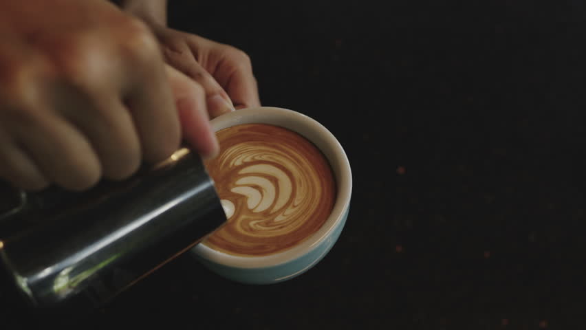 Slow motion Coffee Barista making Latte art, Art of Coffee.
