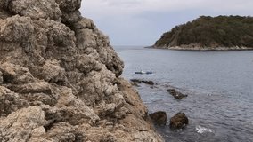The young couple are happily navigating together in a light blue kayak with yellow paddles - Powered by Shutterstock - Get 15% off with code: PIKWIZARD15