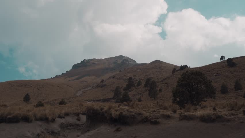 Majestic malinche volcano dominates the landscape under a cloudy sky in mexico