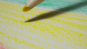 Close-up of Colored Pencil Drawing with Vibrant Yellow and Green Shades on Paper - Powered by Shutterstock - Get 15% off with code: PIKWIZARD15
