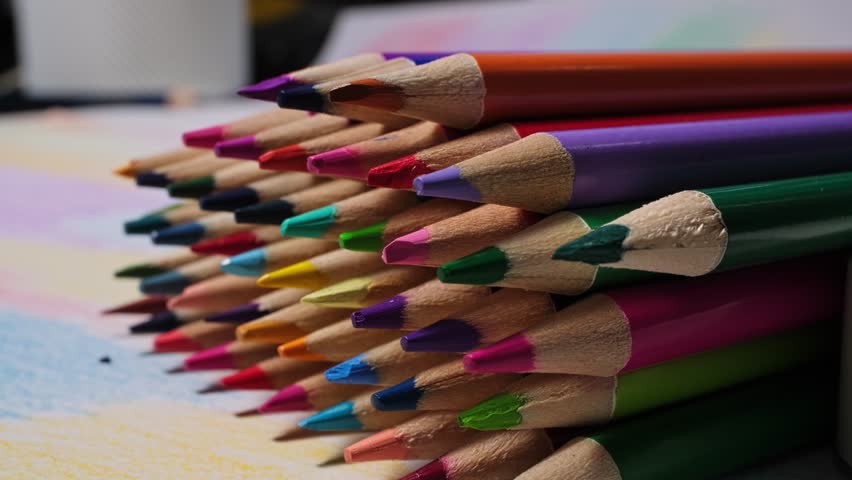 Close-up View of Vibrant Colored Pencils on Artistic Workspace