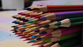 Close-up View of Vibrant Colored Pencils on Artistic Workspace - Powered by Shutterstock - Get 15% off with code: PIKWIZARD15