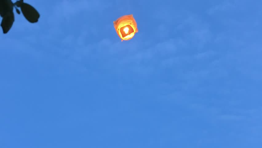 People launched a burning balloon into the air and watched it
