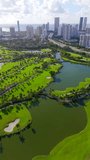 Vertical stock video Aventura Miami Florida. 4k aerial view of golf courses and highrise towers - Powered by Shutterstock - Get 15% off with code: PIKWIZARD15
