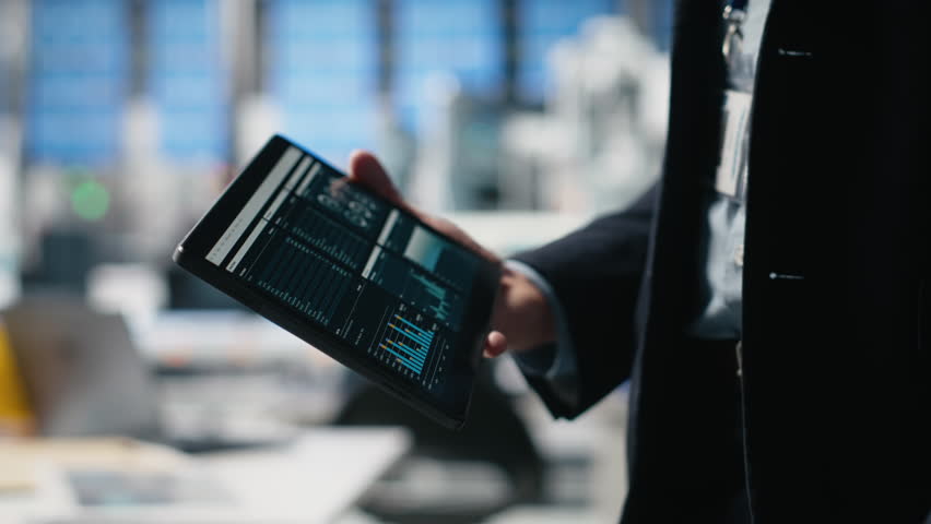 Quality control engineer in a solar power factory evaluating industrial operations, dressed in a suit to reflect corporate oversight and efficiency. Sustainable energy process. Camera A.