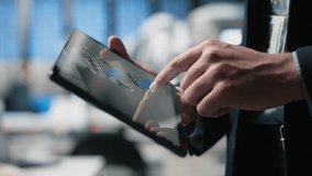 Quality control engineer in a solar power factory evaluating industrial operations, dressed in a suit to reflect corporate oversight and efficiency. Sustainable energy process. Camera A. - Powered by Shutterstock - Get 15% off with code: PIKWIZARD15