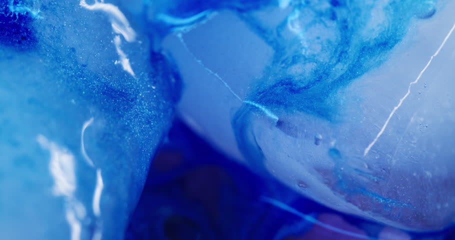 Paint spill. Frost background. Defocused blue color sparkling droplets ice water floating on light creative acrylic cold abstraction.