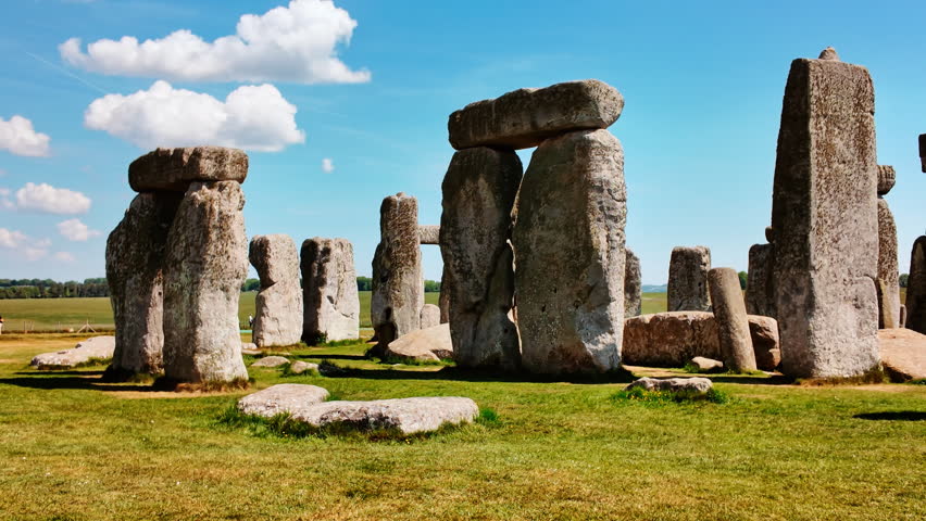 Prehistoric stone pillars and lintels form an iconic monument set on chalky ground at Stonehenge, Salisbury, Wiltshire, England, UK
