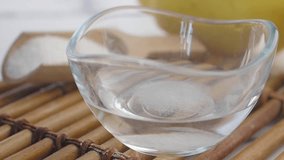 mixing baking soda with a water and slice of lemon on a table  - Powered by Shutterstock - Get 15% off with code: PIKWIZARD15