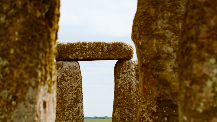 Prehistoric stone pillars and lintels form an iconic monument set on chalky ground at Stonehenge, Salisbury, Wiltshire, England, UK
