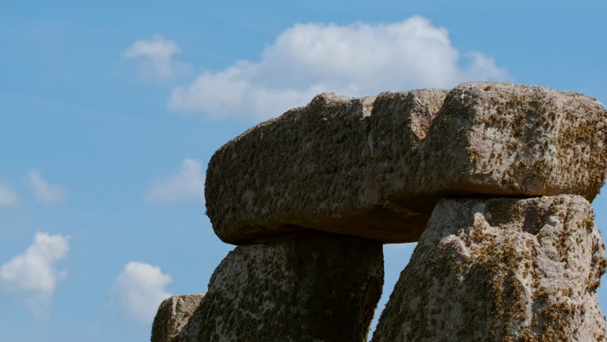 Prehistoric stone pillars and lintels form an iconic monument set on chalky ground at Stonehenge, Salisbury, Wiltshire, England, UK
