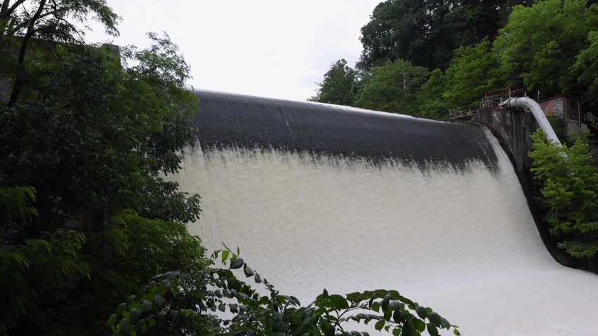 Scenic shots of the Cuyahoga River at Gorge Dam in Summit County, Ohio, where a man-made waterfall and reservoir meet a revitalized natural landscape near Akron and Cuyahoga Falls.
