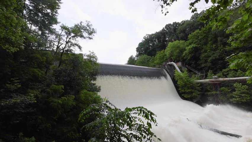 Scenic shots of the Cuyahoga River at Gorge Dam in Summit County, Ohio, where a man-made waterfall and reservoir meet a revitalized natural landscape near Akron and Cuyahoga Falls.