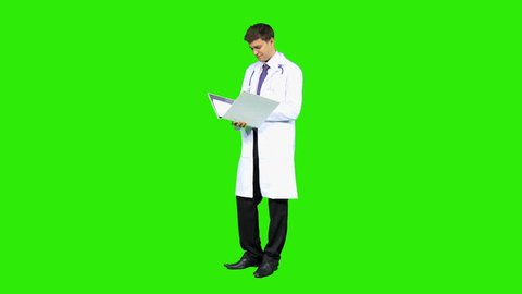 Young Caucasian male junior doctor standing front modern green screen consulting binder drug research
