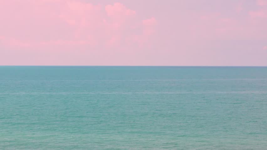 Motor Boat in the Blue Sea, Pink Sunset Sky Clouds in Sunlight Horizon in Sunny Summer Evening. Beautiful Aerial View of the Ocean and Pink Sky with Clouds. Landscape, Background Vacation Tourism.