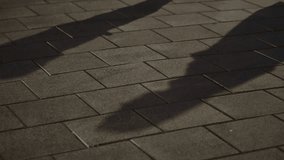 Shadow of two people making shady business deal at night in street alley. Silhouettes of agents or insider moles exchanging envelope and briefcase with bribe hush money. Suspicious white collar scam - Powered by Shutterstock - Get 15% off with code: PIKWIZARD15