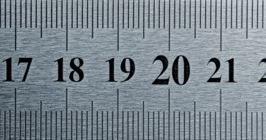 Precision Metal Ruler Close-Up. Video featuring a detailed view of a sleek metal ruler with precise millimeter markings, captured in high clarit.