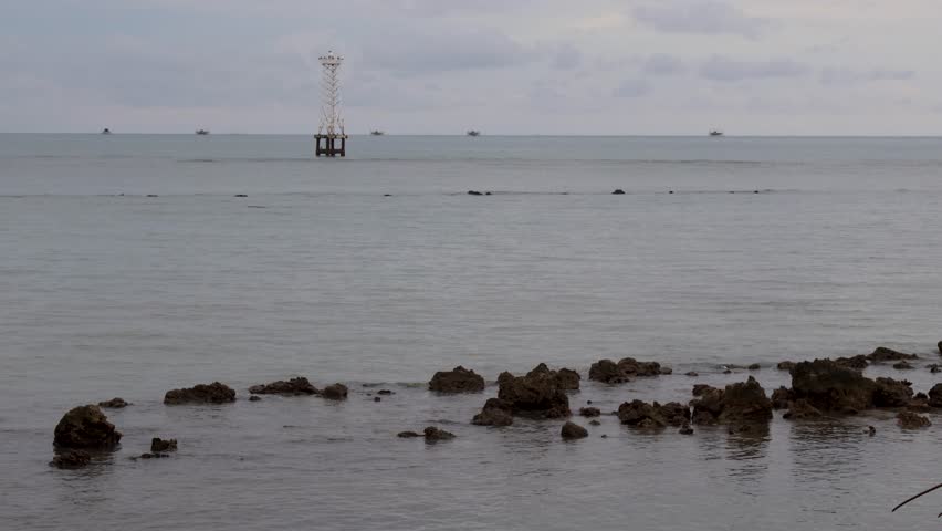 Shallow water beaches are eroded, remaining coral rocks and a few retaining plants such as mangroves.